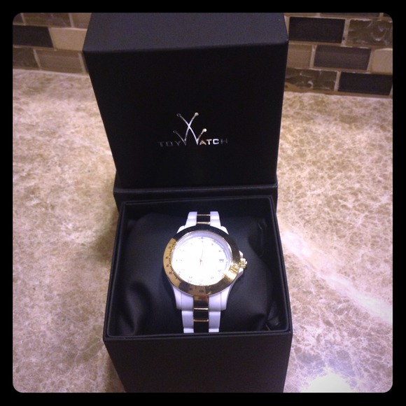 On hold--Toywatch Plasteramic gold and white watch