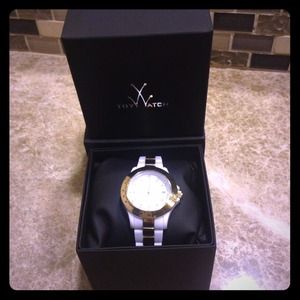 On hold--Toywatch Plasteramic gold and white watch