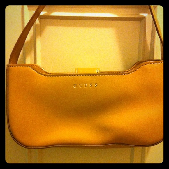 GUESS tan small purse.
