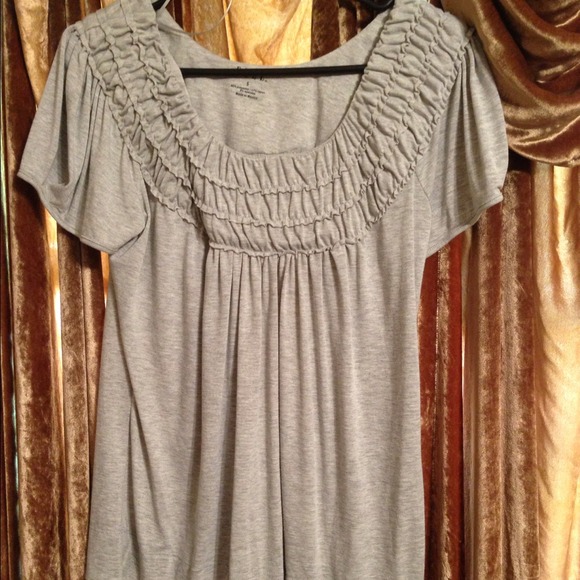Gray flowing shirt.