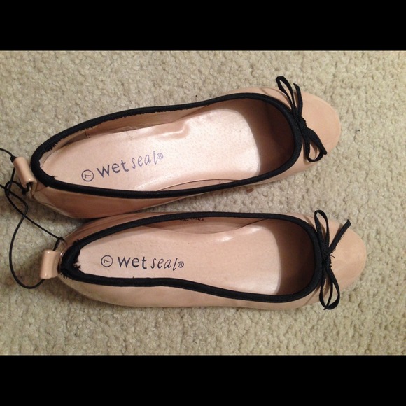 Tan and black flats