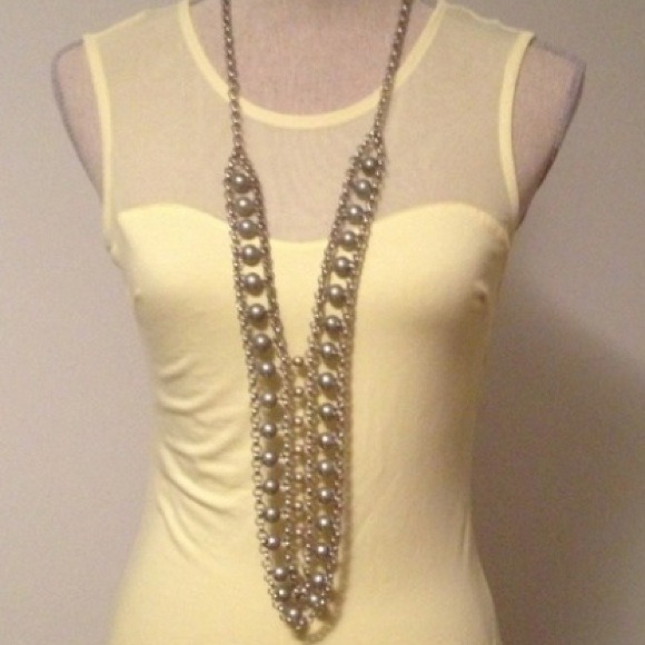 Silver beaded necklace with gold accent