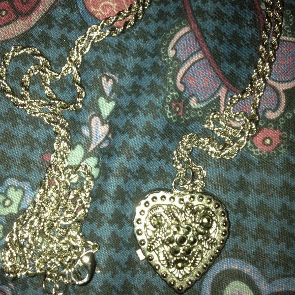 Avon long necklace with heart pendant watch.