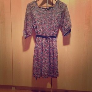 Red, gray, blue polka dot dress with a black belt