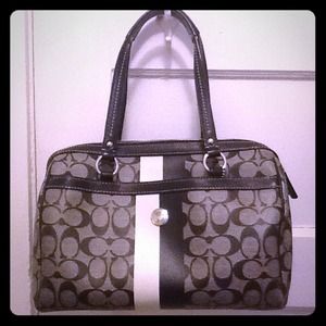 Authentic coach satchel used.