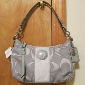 New with tags Silver Coach Purse.