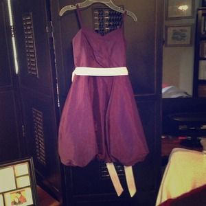 Purple and white formal dress for child.