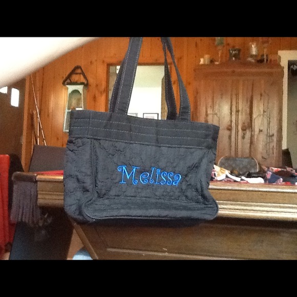 Monogrammed thirty one black paisley bag.