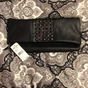 Steve Madden black studded fold over clutch.