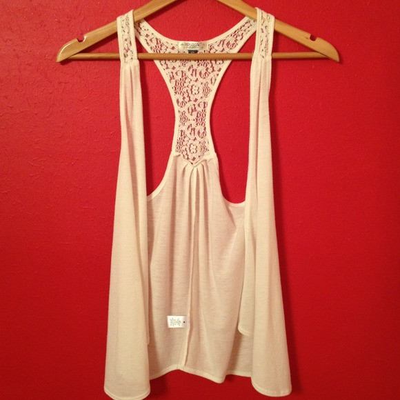 White sleeveless top open front