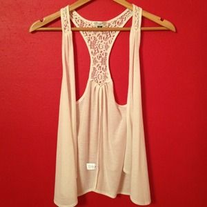 White sleeveless top open front