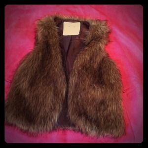 Fuzzy vest goes great with pink