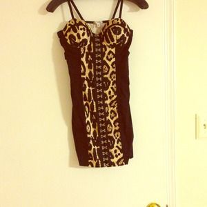 Entry leopard mini dress. Criss crossing sides.