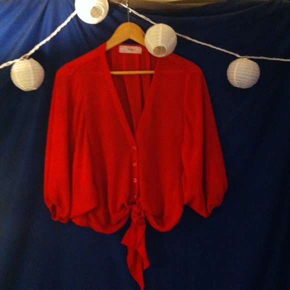 Loose, sheer crimson top with a tie bottom.