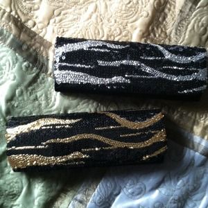 2 clutches..black/silver black/gold
