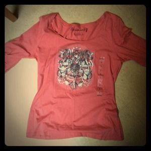 Large. Never worn. Capri sleeve shirt.