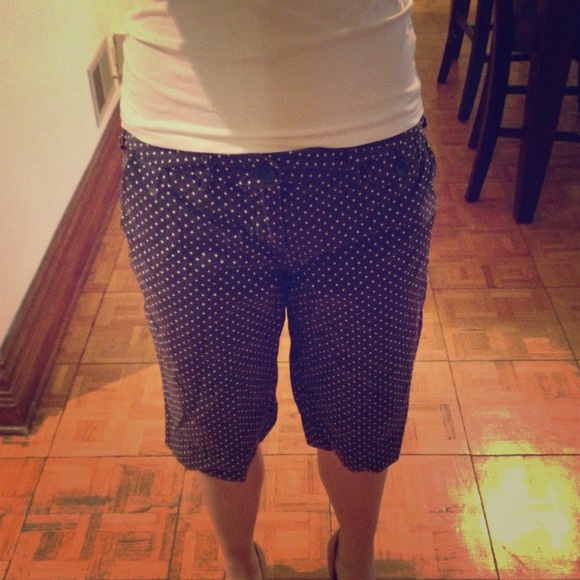 Navy blue Bermuda shorts with white polka dots