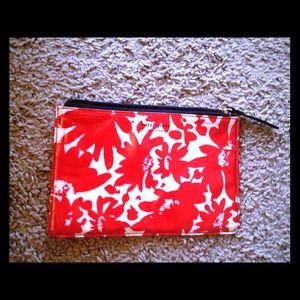 Red and white Kate spade vinyl makeup purse