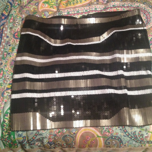Express black, white, and gold sequin mini skirt