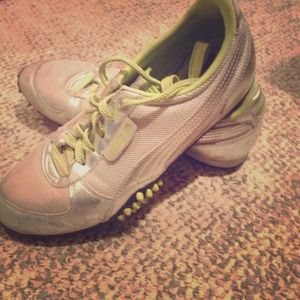 Silver and lime green pumas
