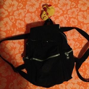 Black Kipling backpack and teddy bear keychain