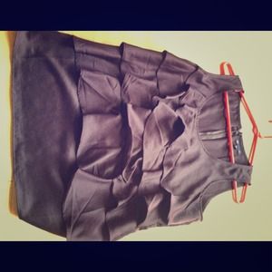 Sleeveless purple shirt with ruffle detail