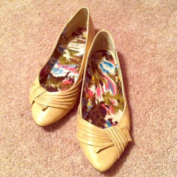 Tan flats with bow on toe