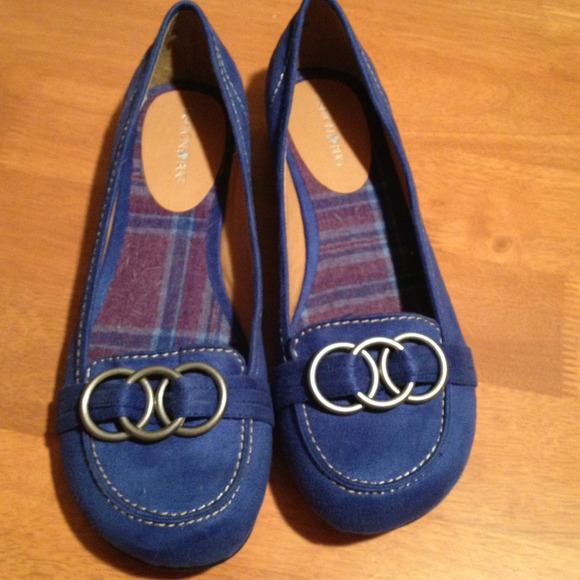 Blue flats with silver decoration.