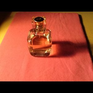 One bottle of cologne, one bottle of body spray
