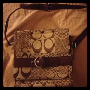 Coach sling purse.