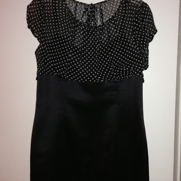 Black satin dress with polka dot sheer top.