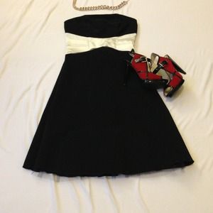 Black cocktail dress with satin white waist band