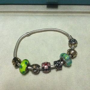 Authentic Pandora bracelet with 7 charms.