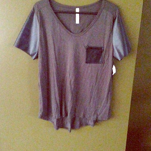 Army green top with leather sleeve