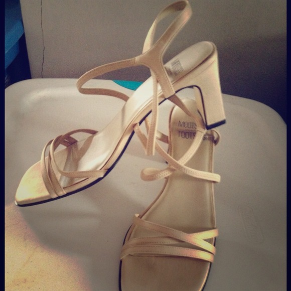Neutral colored heeled sandals.