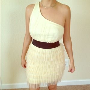 Cream dress with black band.