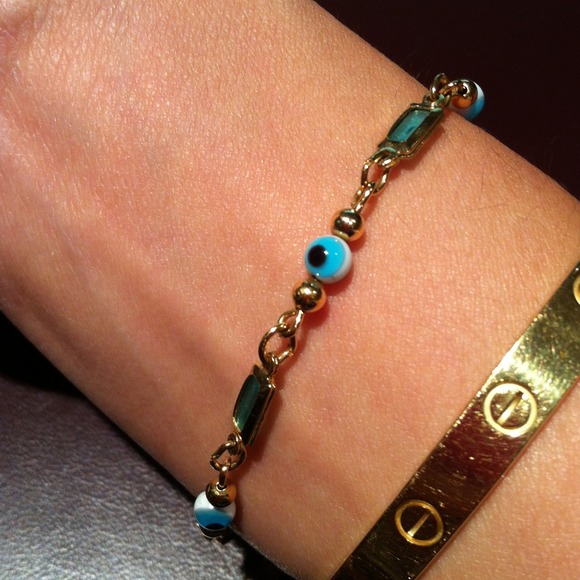 Dainty gold plated "evil eye" chain bracelet.