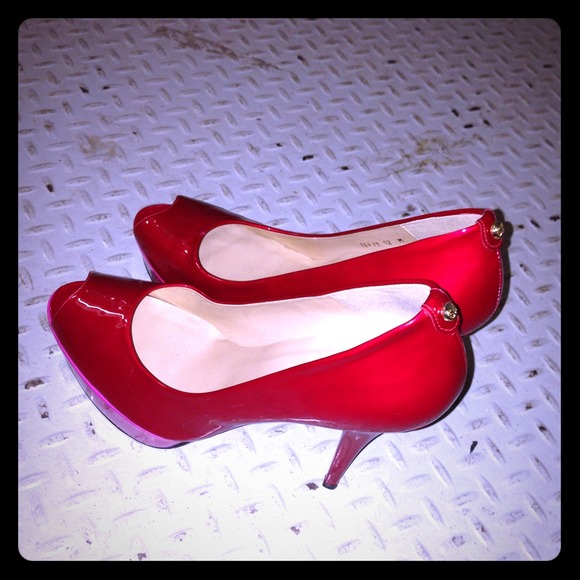 Red platform Peep toe pump by Stuart wietzman