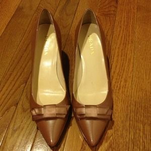 Prada heels, patent leather with bow detail.