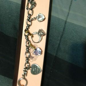 Juicy couture bracelet with add on pieces.