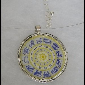 NWOT clear blue and yellow Zodiac Design Necklace