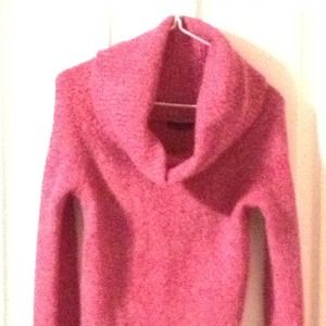 Pink cowl neck sweater.