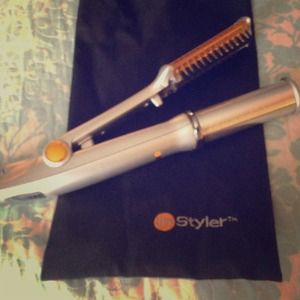 In styler curler with brush. Never been used!