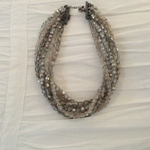 6 strands, sparkles...great with jeans or LBD