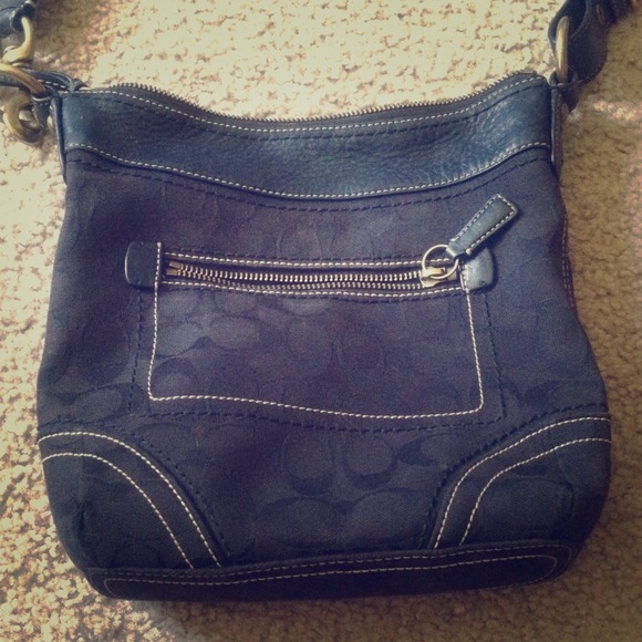 Sold Coach shoulder bag black with brass hardware