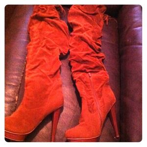 Man made thigh high boots