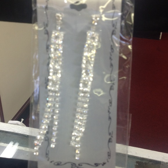 Dangling rhinestone earrings pierced