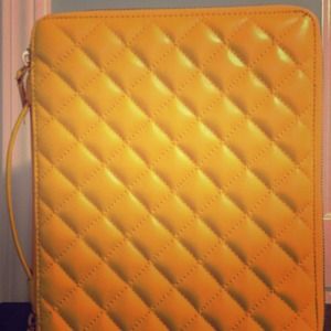 Yellow leather iPad case with gold zipper