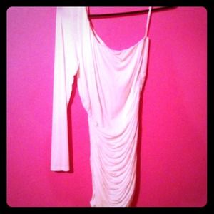 Long sleeve one-shoulder white dress.