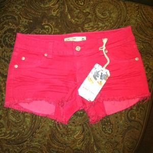 Hot Pink frayed denim shorts